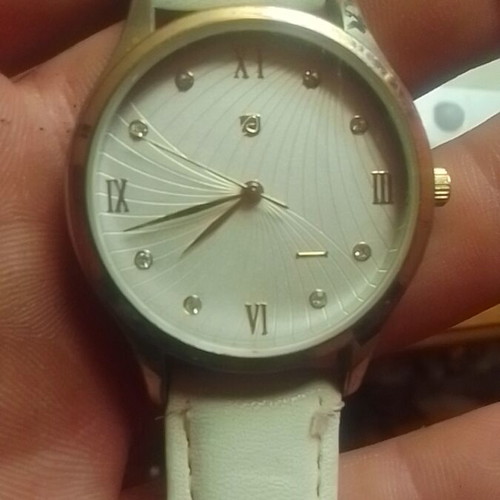 Wristwatch women's new with white strap and quartz mechanism