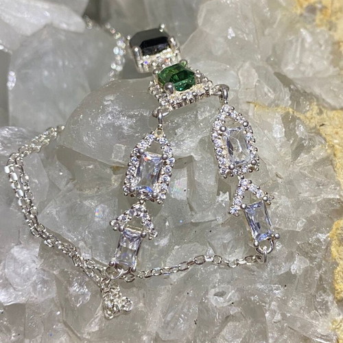 Silver necklace with natural indicolite, green tourmaline, topaz and moissanite