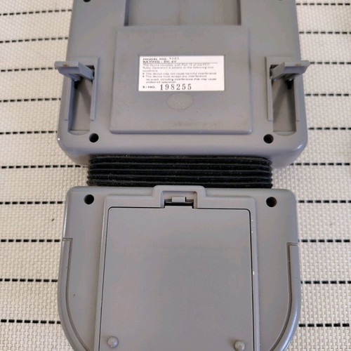 Watara Supervision console used with 3 games