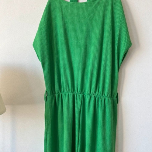 Emerald green one-piece jumpsuit with sleeves and waist belt