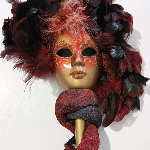 Mask with handle used, burgundy shades with minor wear