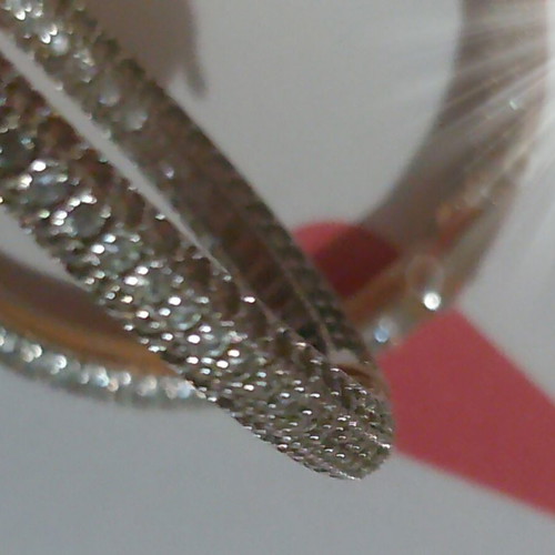 Gold hoop earrings with zircon stones