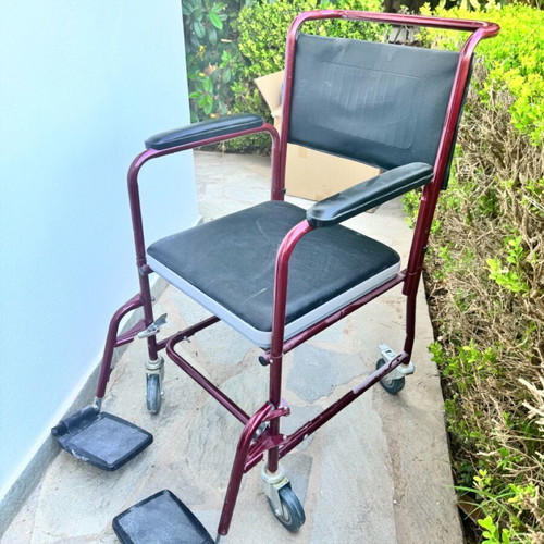 Red toilet wheelchair like new, missing container