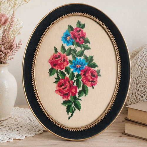 Vintage handmade cross-stitch frame with velvet oval border used