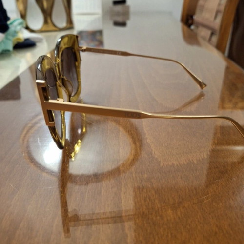 Tod's sunglasses new, gold color