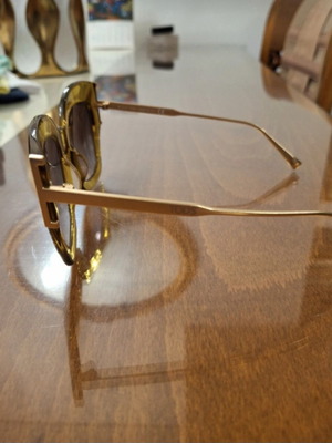 Tod's sunglasses new, gold color