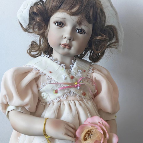 Alberon Casey porcelain doll with wooden stand, 50cm