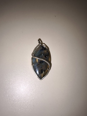 Opal pendant with silver used, snake shape