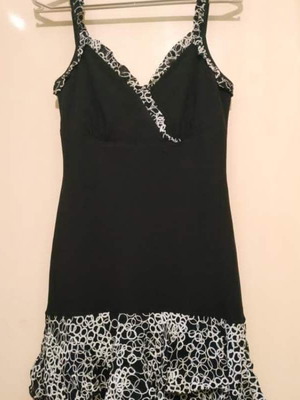 Black strap dress used, size L, with designs to the knee
