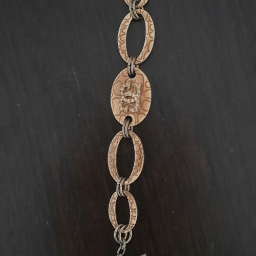 Guess vintage beige gold bracelet with rings and logo strass used