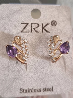 Stainless steel earrings new with purple zirconia and small white stones
