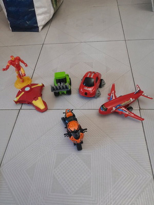 Toy vehicles used, set with airplanes, car, motorcycle and Ironman figure