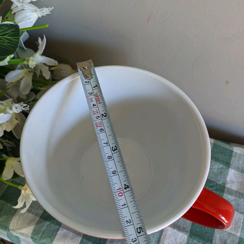 Large mug used for coffee or cereals, red