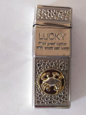 Αναπτήρας Lucky μεταχειρισμένος, μεταλλικός με φως και μουσική