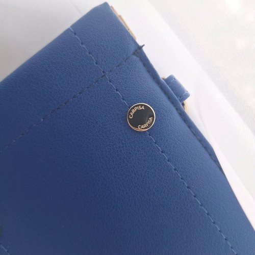Small Carpisa bag like new, deep blue with strap