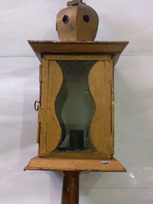 Lantern used, made of sheet metal with gold paint and signs of wear