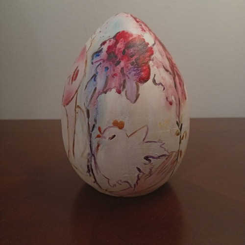 Hand-painted ceramic egg with floral and female figure design