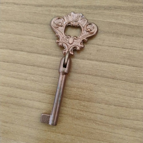 Vintage brass key refurbished with rose gold paint