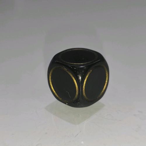 Collectible D&D 2003 die black with gold stars like new