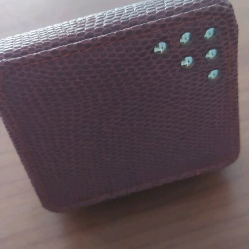 Windproof lighter new in leather-type case, unused
