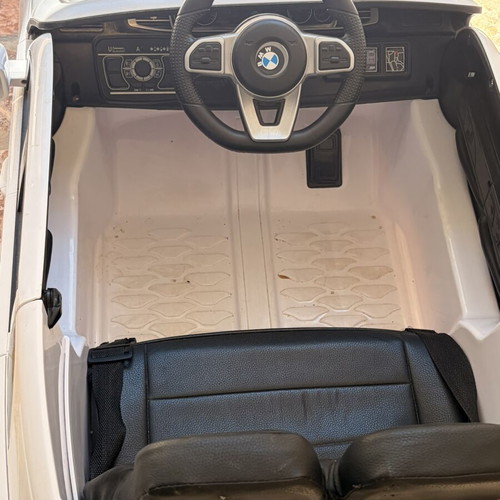 BMW Electric Ride-On Car like new with remote control and charger