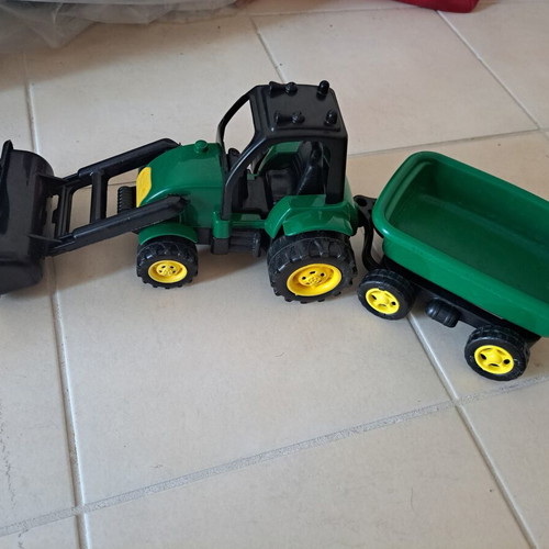 Plastic toy tractor with excavator and detachable trailer