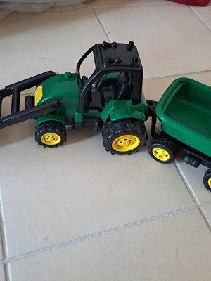 Plastic toy tractor with excavator and detachable trailer