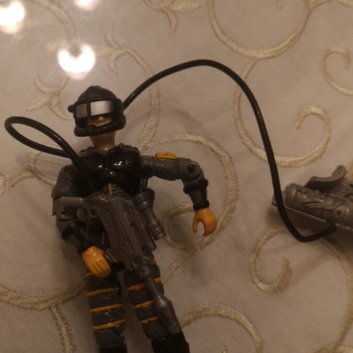 G.I. Joe action figure with weapons