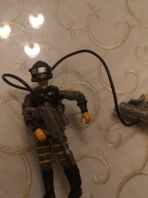 G.I. Joe action figure with weapons