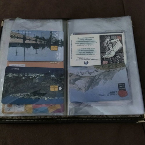 Collectible old phone cards used with album