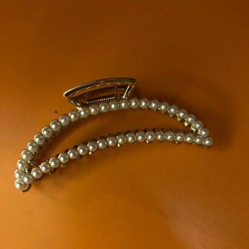 Metal hair clips like new, 3 gold with designs