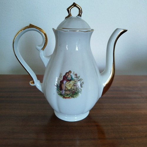 Porcelain teapot vintage with gold details used