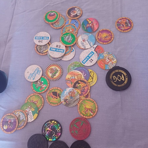 Vintage Pogs collection with Pokemon and Looney Tunes