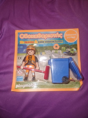 Playmobil street cleaner figure with broom and blue recycling bin