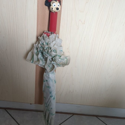 Lacoste vintage umbrella used with collectible Minnie Mouse