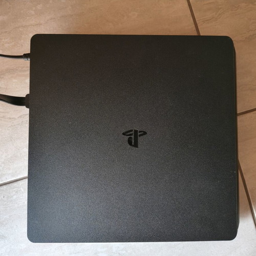 PS4 Slim 1TB console used with 3 games and 1 controller