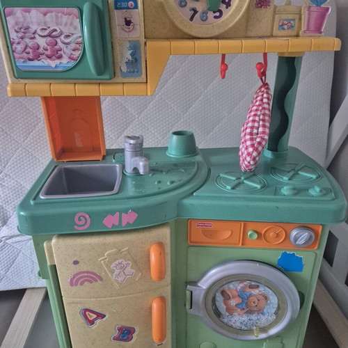 Fisher Price children's play kitchen with microwave and washing machine