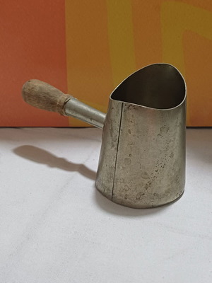 Vintage briki used for Greek coffee with wooden handle