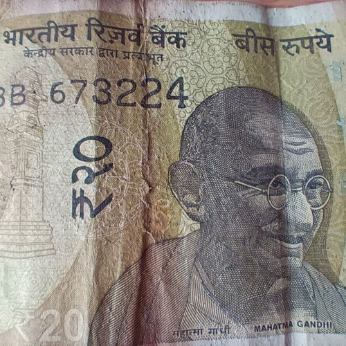 Indian 20 Rupees banknote used with tear