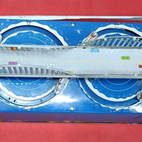 Tin wind-up toy used with key and moving boats