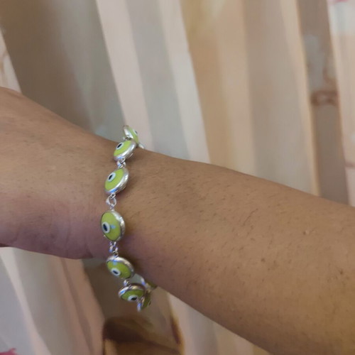Silver bracelet like new, green accents