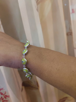 Silver bracelet like new, green accents