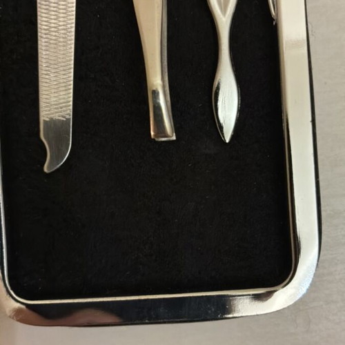 Max Factor nail care set with scissors, clippers, file, tweezers, cuticle tool
