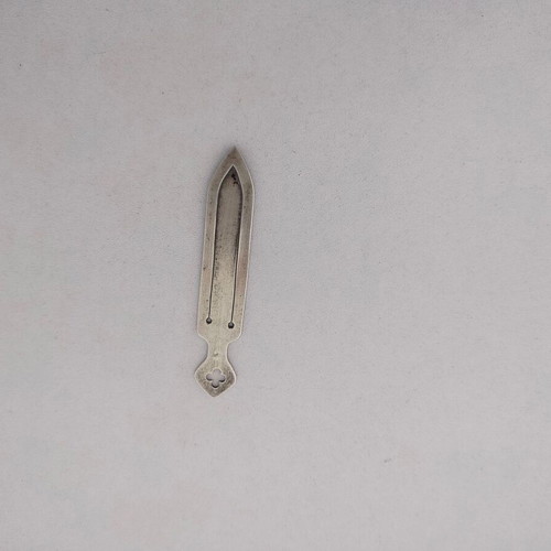 Silver bookmark with cross-shaped handle, used