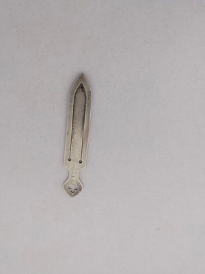 Silver bookmark with cross-shaped handle, used