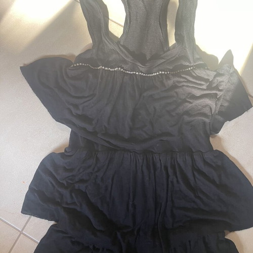 Black sleeveless blouse with ruffles and sporty back like new, size M