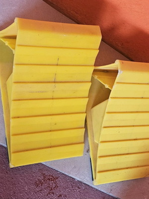 Used wheel chocks, 2 plastic and 1 wooden homemade