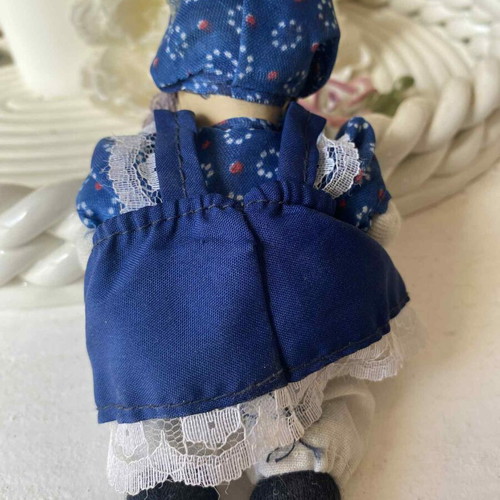 Vintage ceramic collectible doll with cloth limbs