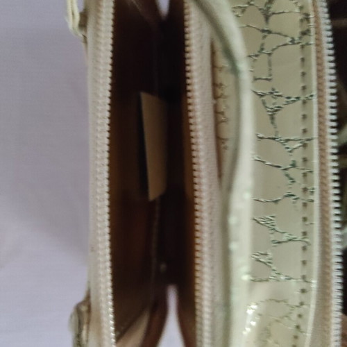 Small gold wristlet shoulder bag
