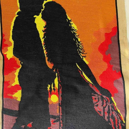 Handmade embroidered textile painting like new, silhouette of a couple at sunset